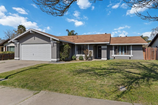 single story home with stucco siding, a front yard, driveway, and fence