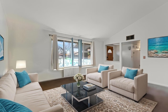 living area with visible vents and lofted ceiling