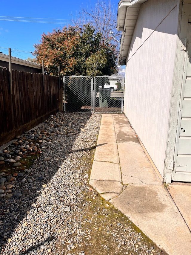 view of yard with a gate and fence