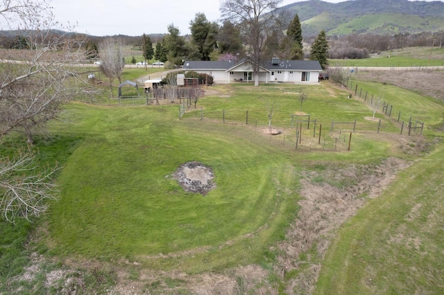 bird's eye view featuring a rural view and a mountain view