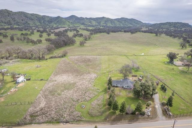 aerial view with a mountain view and a rural view