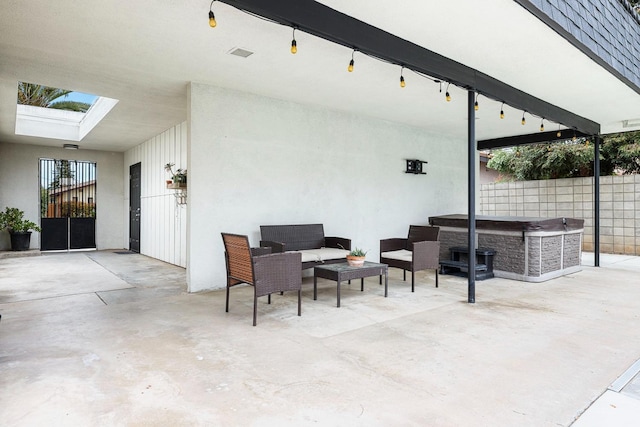 view of patio featuring fence and an outdoor hangout area