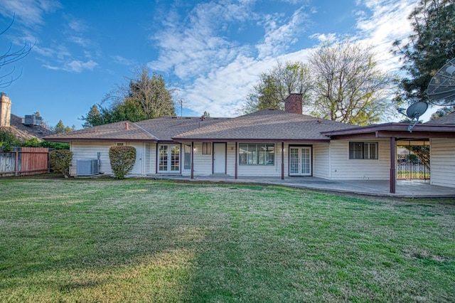 back of house featuring a patio, fence, french doors, a yard, and cooling unit