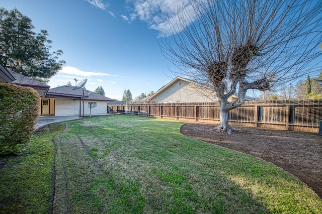 view of yard with a fenced backyard