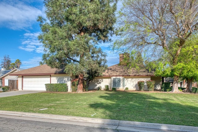 ranch-style home with a chimney, concrete driveway, a garage, and a front yard