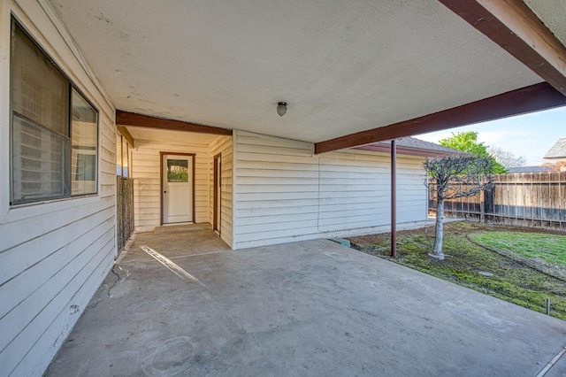 view of patio featuring fence