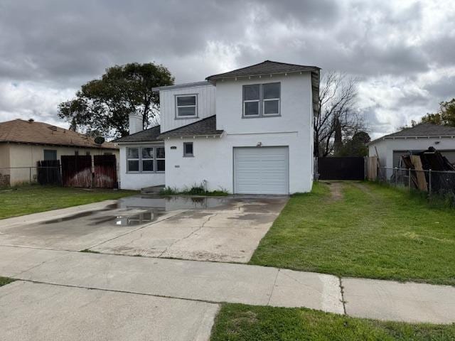 traditional home featuring fence, driveway, stucco siding, a front lawn, and a garage