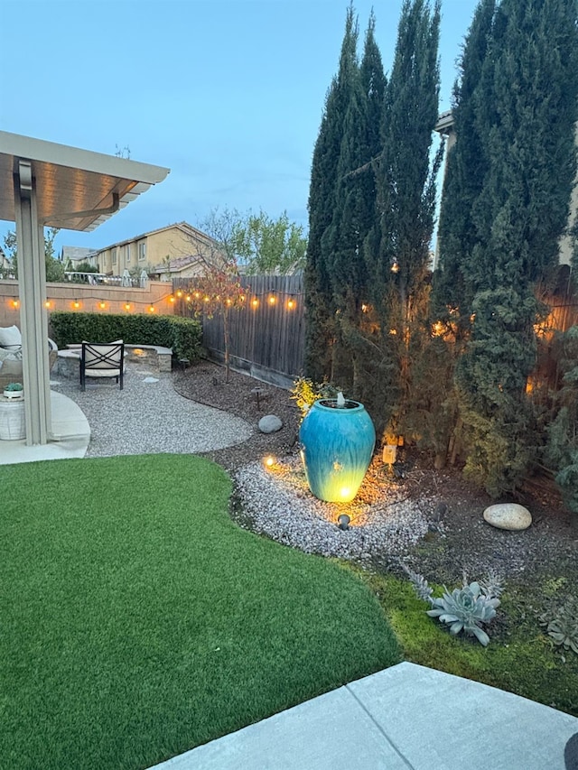 view of yard featuring a patio and fence