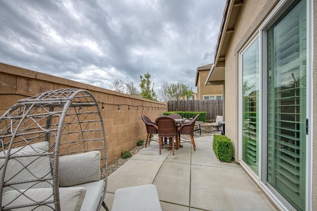 view of patio / terrace featuring outdoor dining area and a fenced backyard