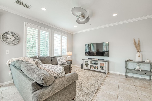 living area featuring light tile patterned floors, visible vents, baseboards, and ornamental molding