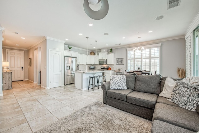 living area with visible vents, light tile patterned flooring, crown molding, and a chandelier