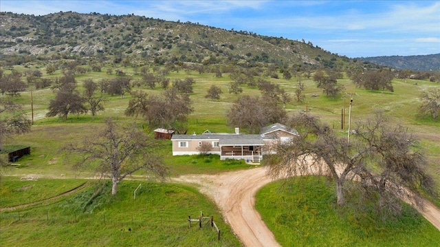 birds eye view of property with a rural view and a mountain view