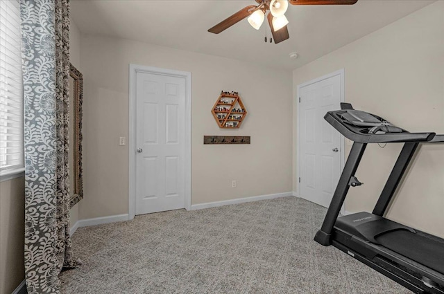 exercise room featuring baseboards, carpet floors, and ceiling fan