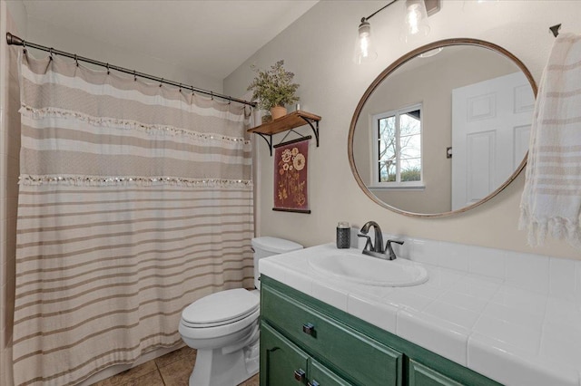 bathroom with tile patterned floors, a shower with curtain, toilet, and vanity