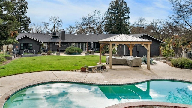 outdoor pool with fence, a hot tub, a gazebo, a patio area, and a lawn