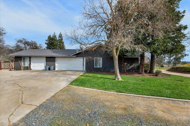 single story home featuring stucco siding, fence, concrete driveway, a front yard, and a garage