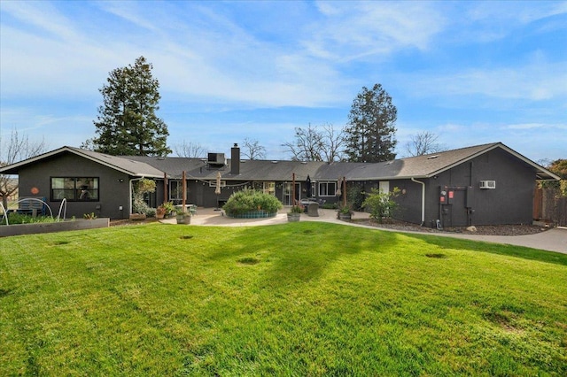 view of front of home with a front lawn, central AC, and a chimney