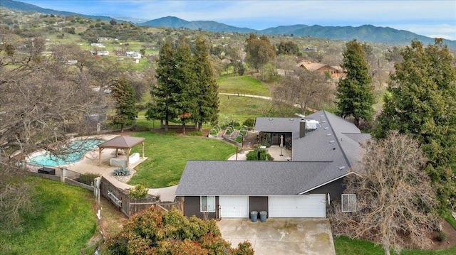 birds eye view of property featuring a mountain view