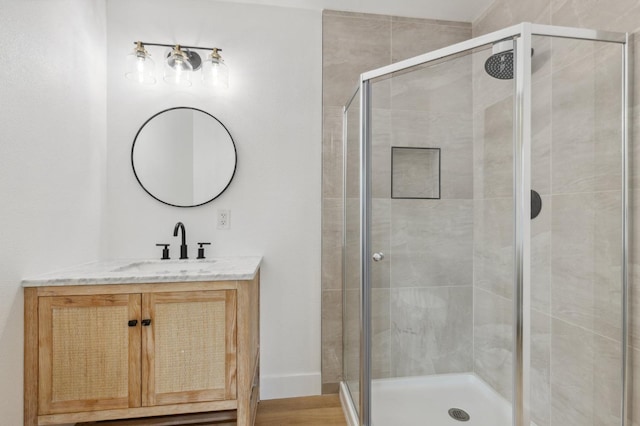 full bath featuring vanity and a stall shower