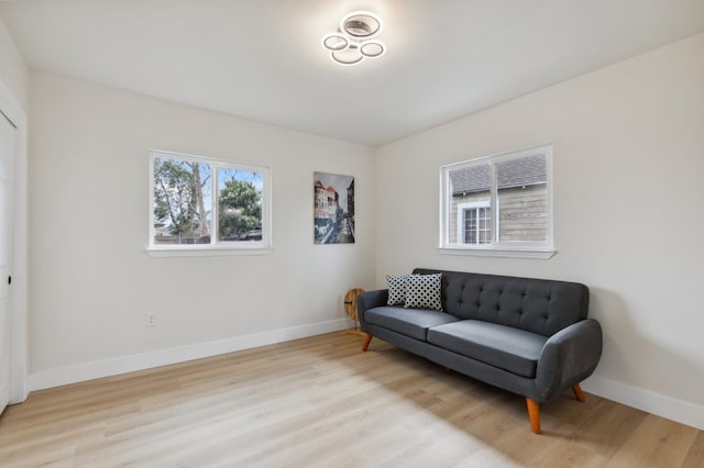 sitting room featuring light wood-style floors and baseboards