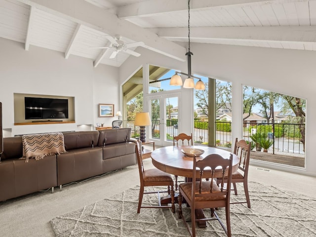 dining area with carpet flooring, wooden ceiling, vaulted ceiling with beams, and ceiling fan