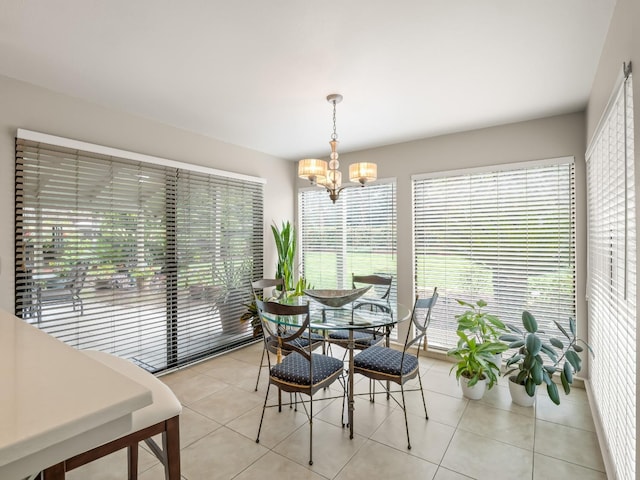 dining room featuring an inviting chandelier and light tile patterned floors