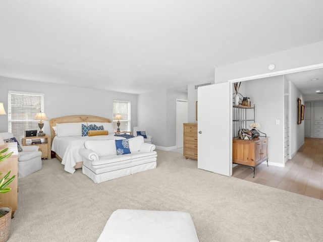 bedroom featuring baseboards and carpet flooring