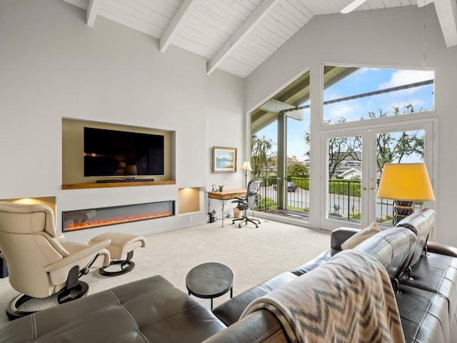 carpeted living area featuring a glass covered fireplace, beam ceiling, wood ceiling, and high vaulted ceiling