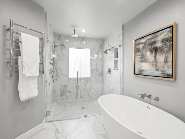 full bathroom featuring a marble finish shower, a soaking tub, marble finish floor, and baseboards