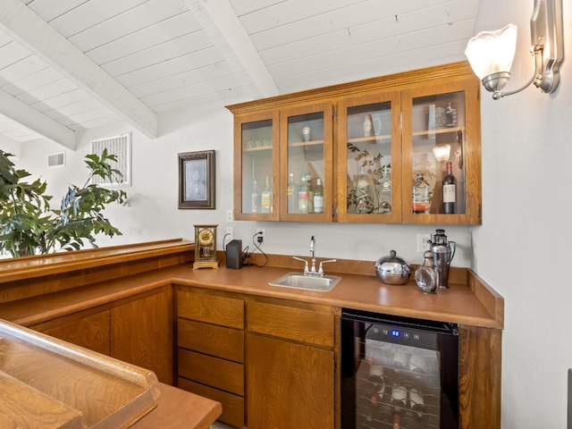 bar with wet bar, beam ceiling, a sink, wine cooler, and wooden ceiling