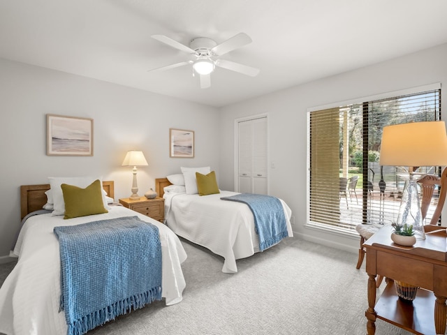 bedroom with baseboards, carpet, and a ceiling fan