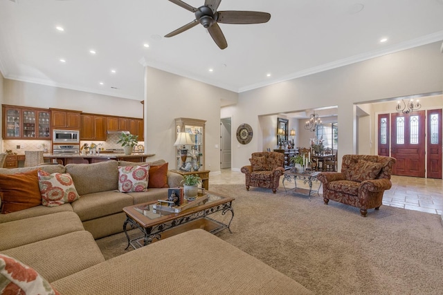 living room with light colored carpet, crown molding, and a high ceiling