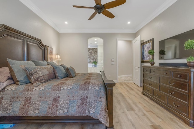 bedroom featuring recessed lighting, light wood-style floors, arched walkways, and ornamental molding