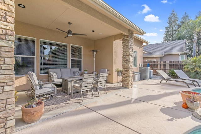 view of patio / terrace with an outdoor hangout area, ceiling fan, outdoor dining space, and fence