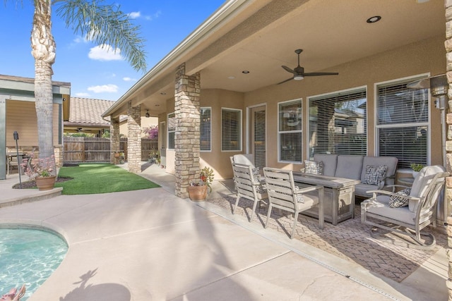 view of patio with outdoor dining space, an outdoor living space, a ceiling fan, and fence