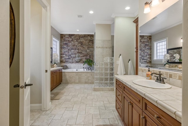 bathroom with visible vents, ornamental molding, decorative backsplash, a bath, and vanity