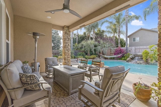 view of patio with a fenced backyard, a fenced in pool, and ceiling fan