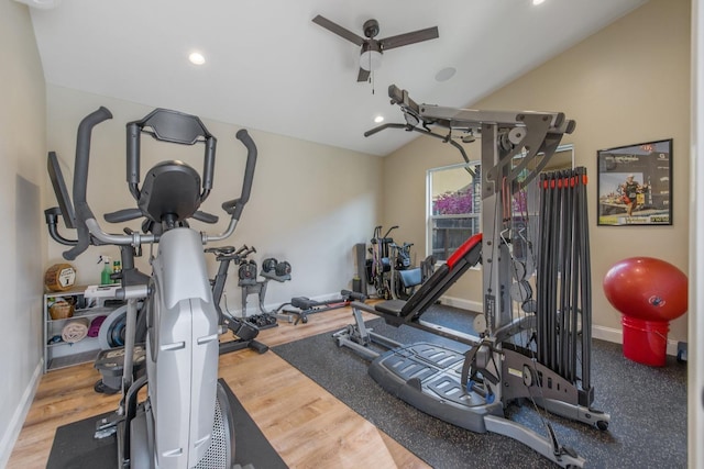 workout area with recessed lighting, baseboards, lofted ceiling, and wood finished floors