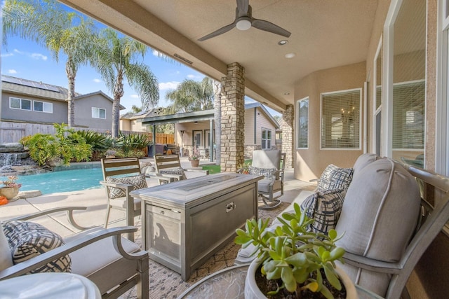 view of patio with fence, a fenced in pool, and ceiling fan