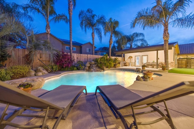 view of swimming pool featuring a fenced in pool, a patio, and a fenced backyard