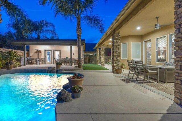 view of swimming pool featuring outdoor dining space, a fenced in pool, a patio area, and fence