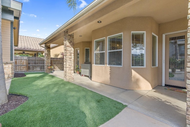 view of yard with a patio and fence