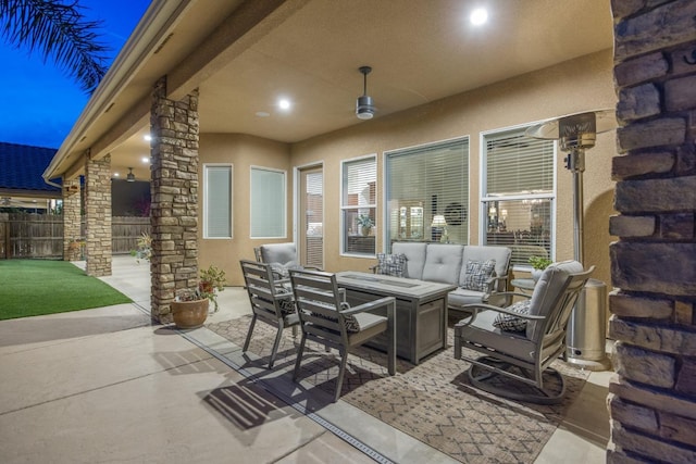 view of patio / terrace featuring outdoor lounge area and fence