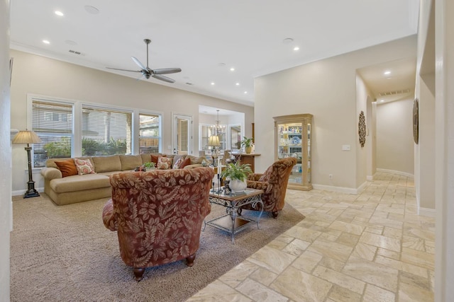 living area featuring recessed lighting, visible vents, ceiling fan with notable chandelier, and baseboards