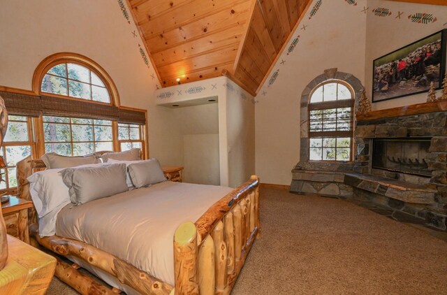 bedroom with a fireplace, carpet, wooden ceiling, and high vaulted ceiling