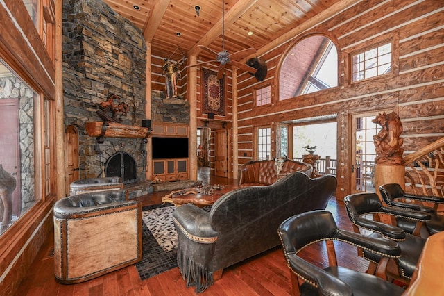 living room with beam ceiling, wooden ceiling, a fireplace, high vaulted ceiling, and wood-type flooring
