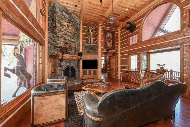 living area featuring high vaulted ceiling, a fireplace, wood-type flooring, wooden ceiling, and beamed ceiling