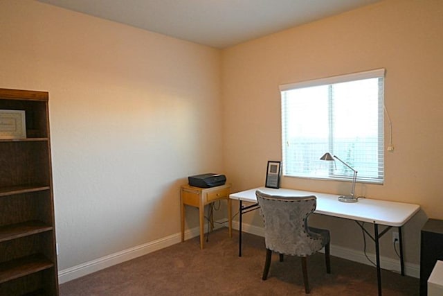 carpeted home office with baseboards