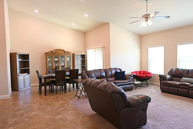 tiled living room with recessed lighting, a ceiling fan, and baseboards