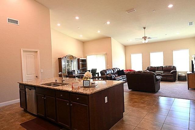 kitchen with dishwasher, ceiling fan, visible vents, and a sink